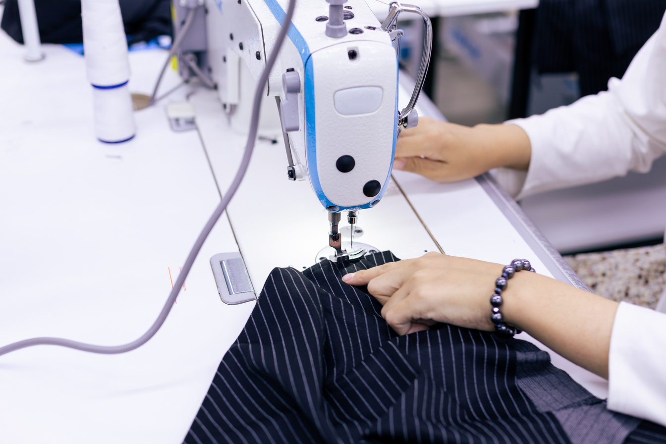 Tailor Working on Electric Sewing Machine